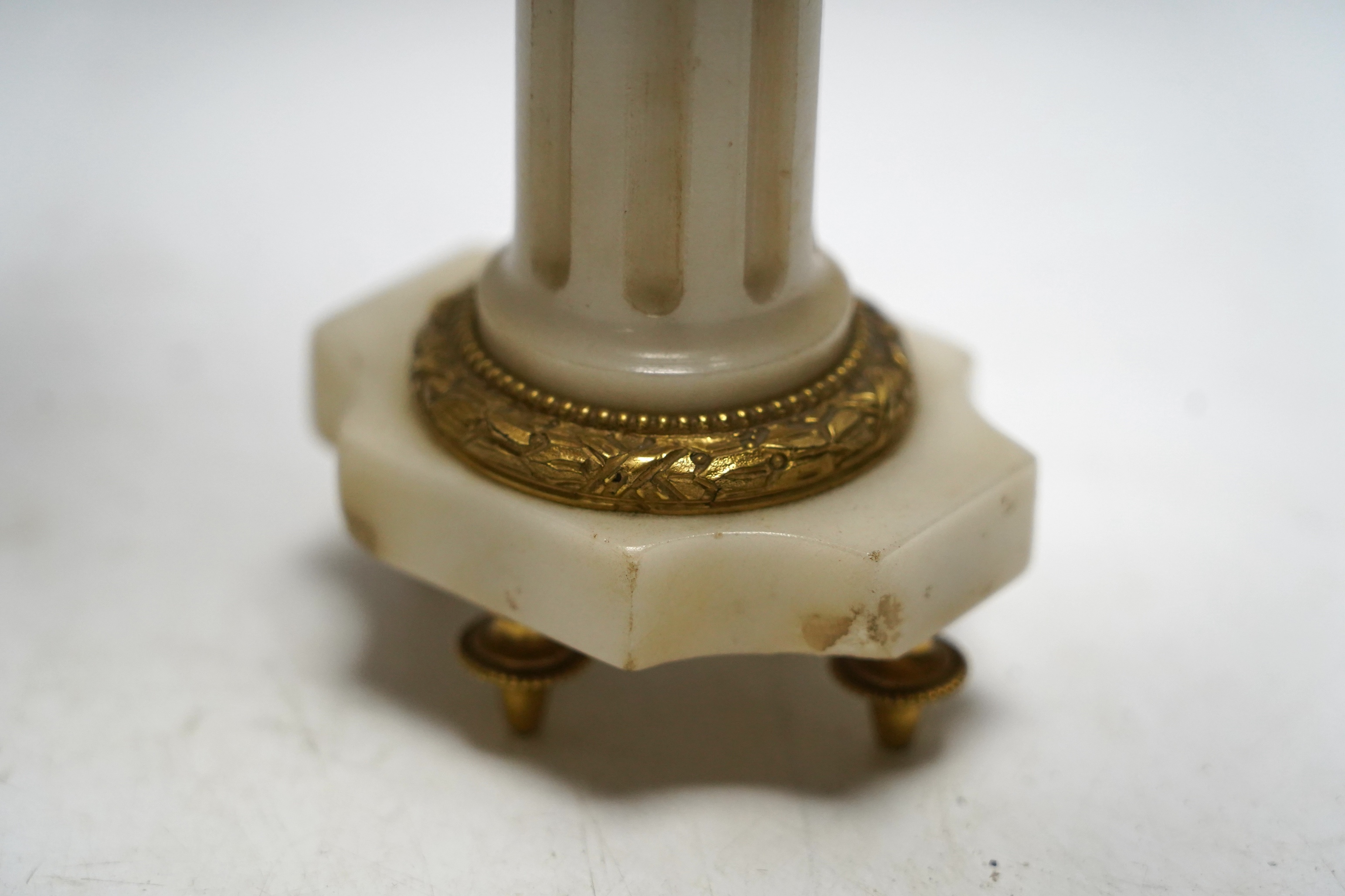 A pair of late 19th century alabaster and gilt metal two light candelabra, 22cm. Condition - good